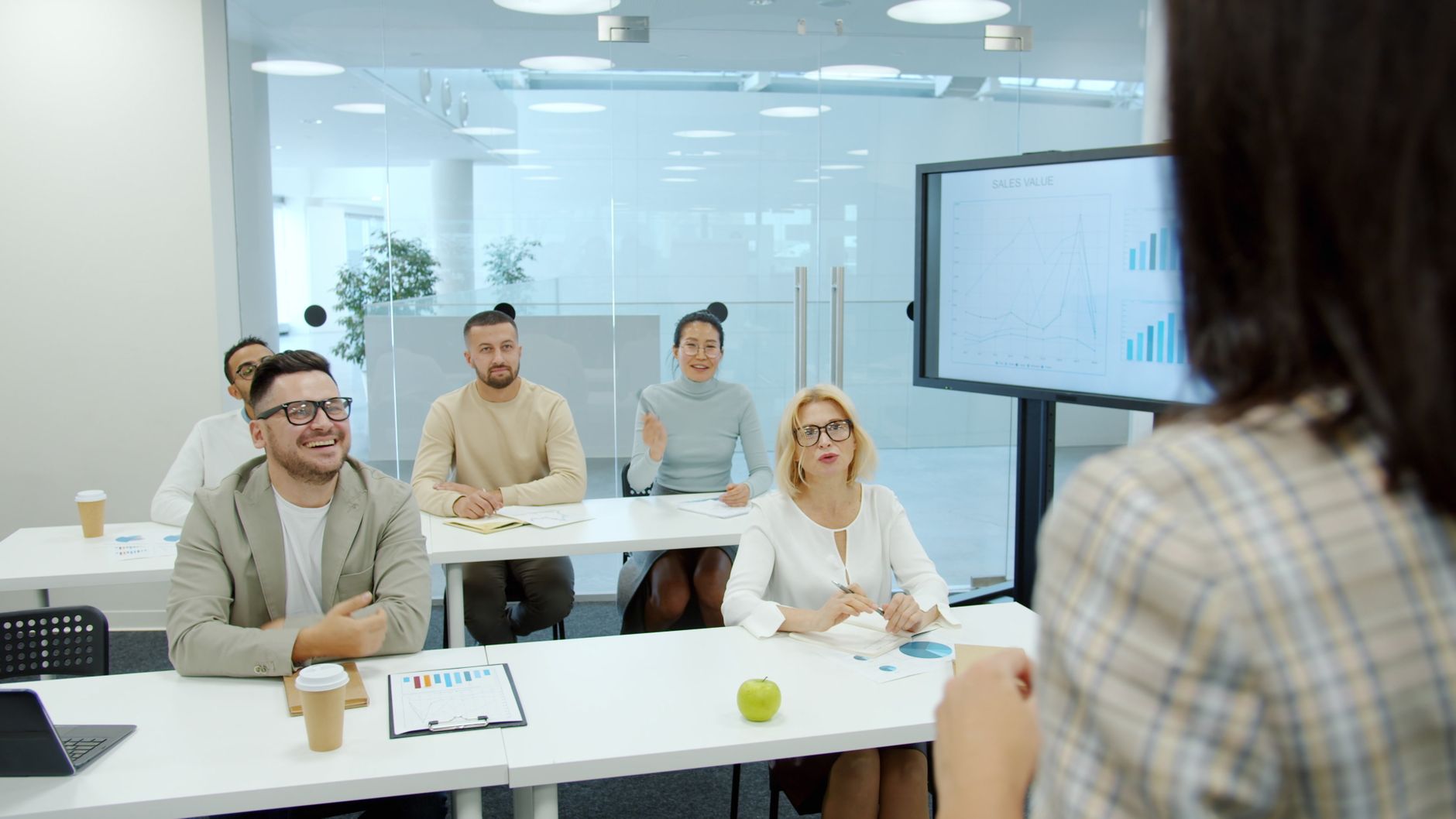 Corporate meeting with diverse team discussing growth strategies.