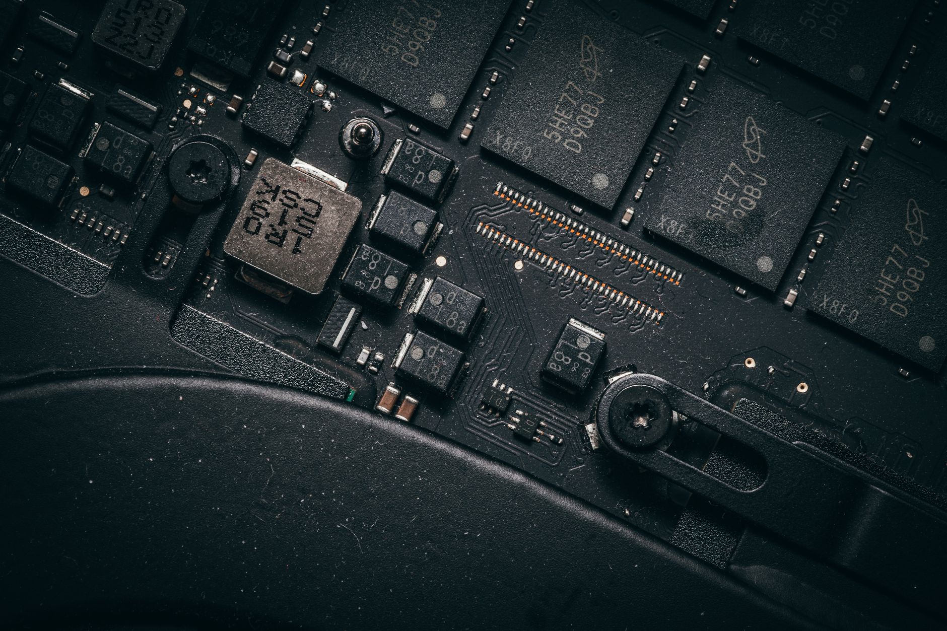 Detailed macro shot of electronic circuit board showing microchips and components.